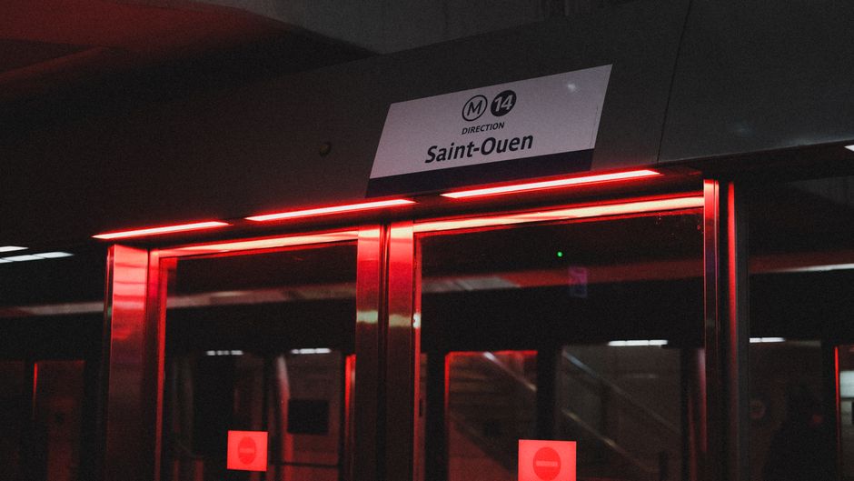 A clean and efficient Paris Metro station with a train arriving, highlighting public transport options.