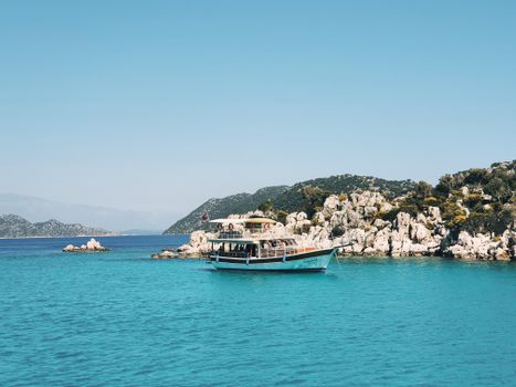 Explore the serene turquoise waters of Antalya, Turkey, on a peaceful boat ride.