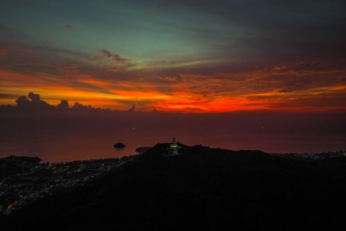 Free A vibrant sunset paints the sky over Bang Nai Si, Phang-nga, Thailand, creating a stunning coastal scene. Stock Photo