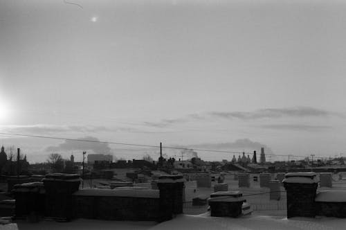 Grayscale Photo of Snowy Day in a Town