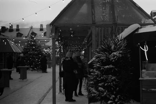 Grayscale Photo of People Waiting in Line