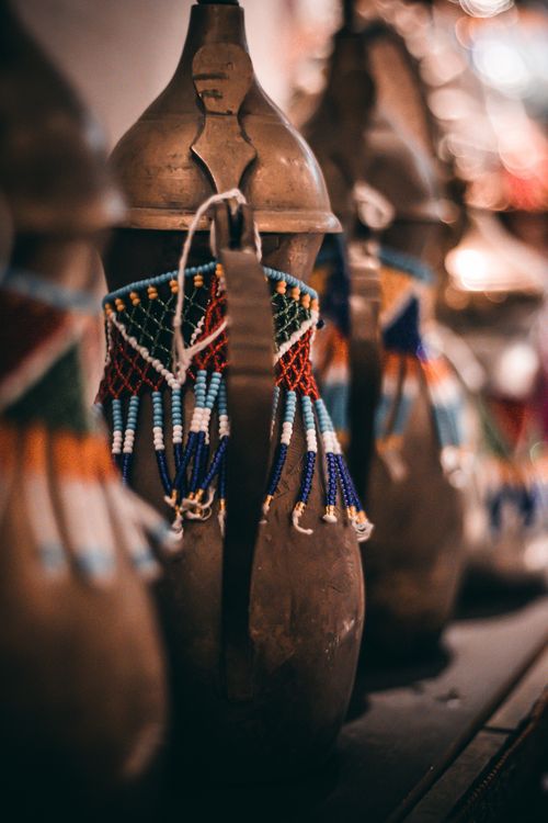Free Close-up of handmade beaded vases showcasing traditional art. Perfect for cultural and artistic themes. Stock Photo