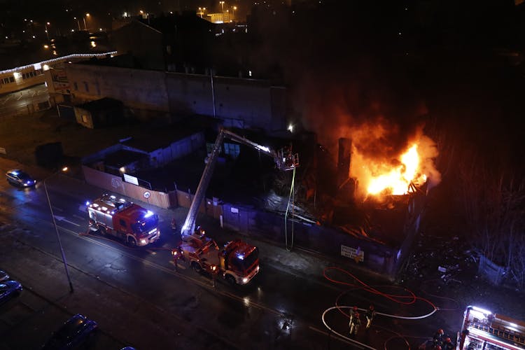 An Aerial Photography Of Fire Trucks On The Road