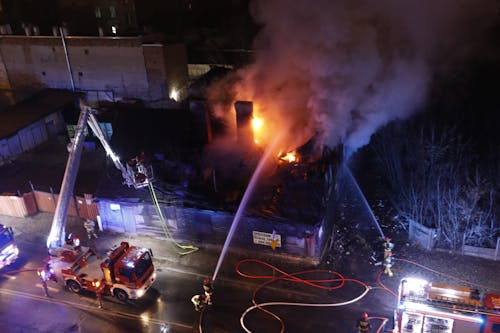 Firefighters Extinguishing Fire at Night