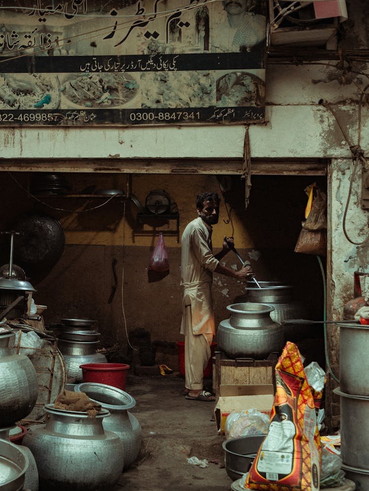 Man Cooking Inside The Store