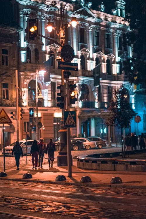People Walking on the Street at Night