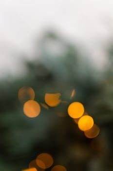 Out-of-focus bokeh effect with warm yellow lights on a soft blurred background.