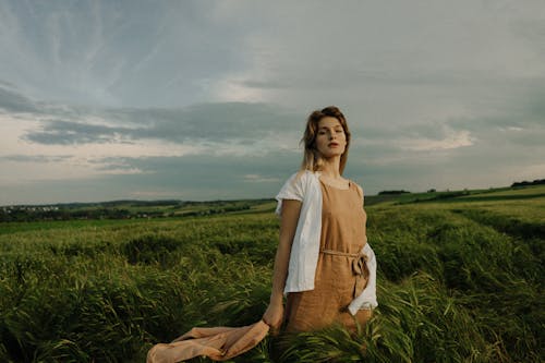 Woman Standing in Field