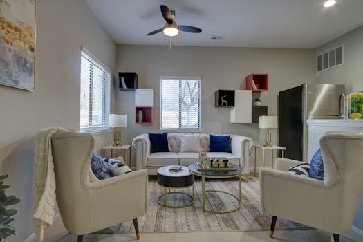 Stylish living room with armchairs, sofa, and contemporary décor for a cozy ambiance.