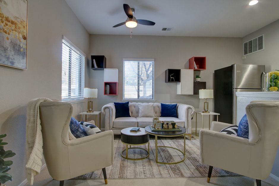 Stylish living room with armchairs, sofa, and contemporary décor for a cozy ambiance.
