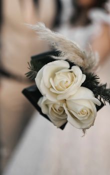 A close-up of an elegant white rose bouquet, perfect for weddings.