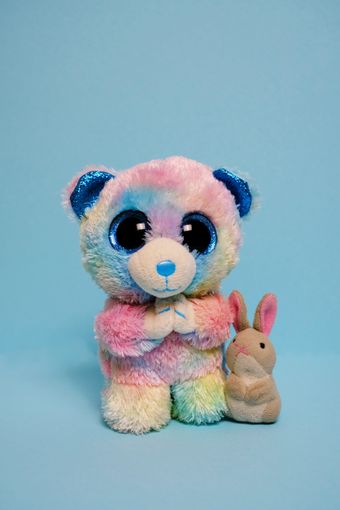 Rainbow plush bear beside a small plush bunny, photo by Konna Jpg on Pexels