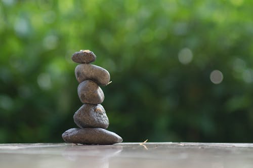 Free pile of stone with green bokeh background Stock Photo