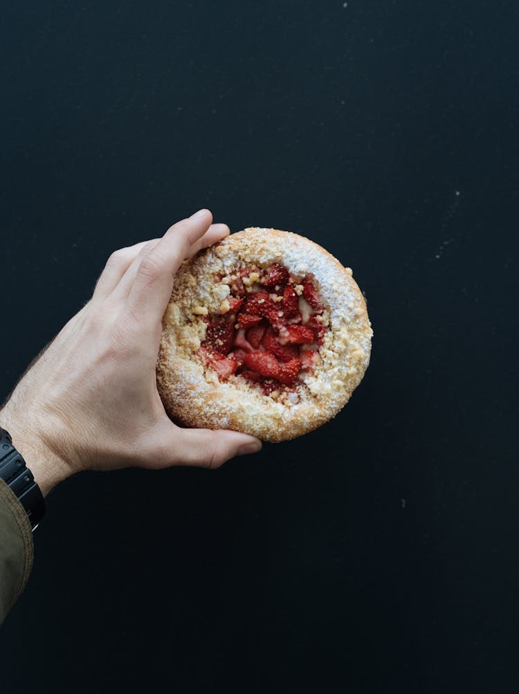 Person Holding An English Muffin