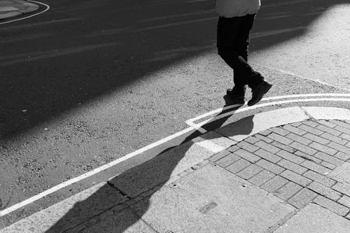 Free A Person Crossing the Street Stock Photo