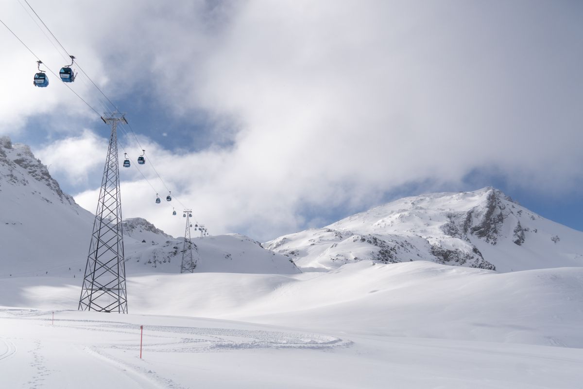 Snowy winter landscape with mountains in the distance