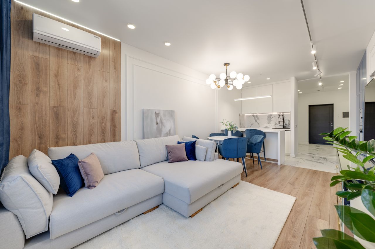 Contemporary living room with stylish furniture and elegant chandelier