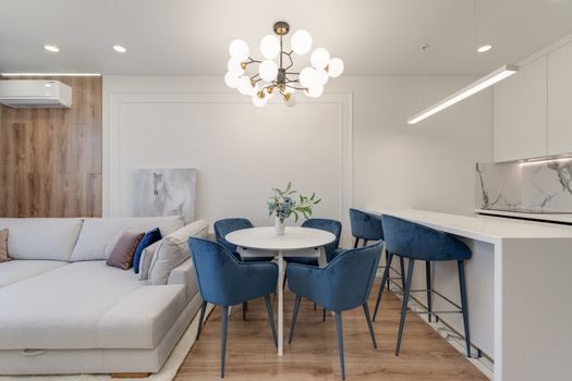Table and Chairs in Living Room with Kitchenette