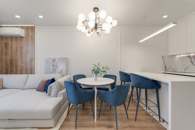 Table And Chairs In Living Room With Kitchenette