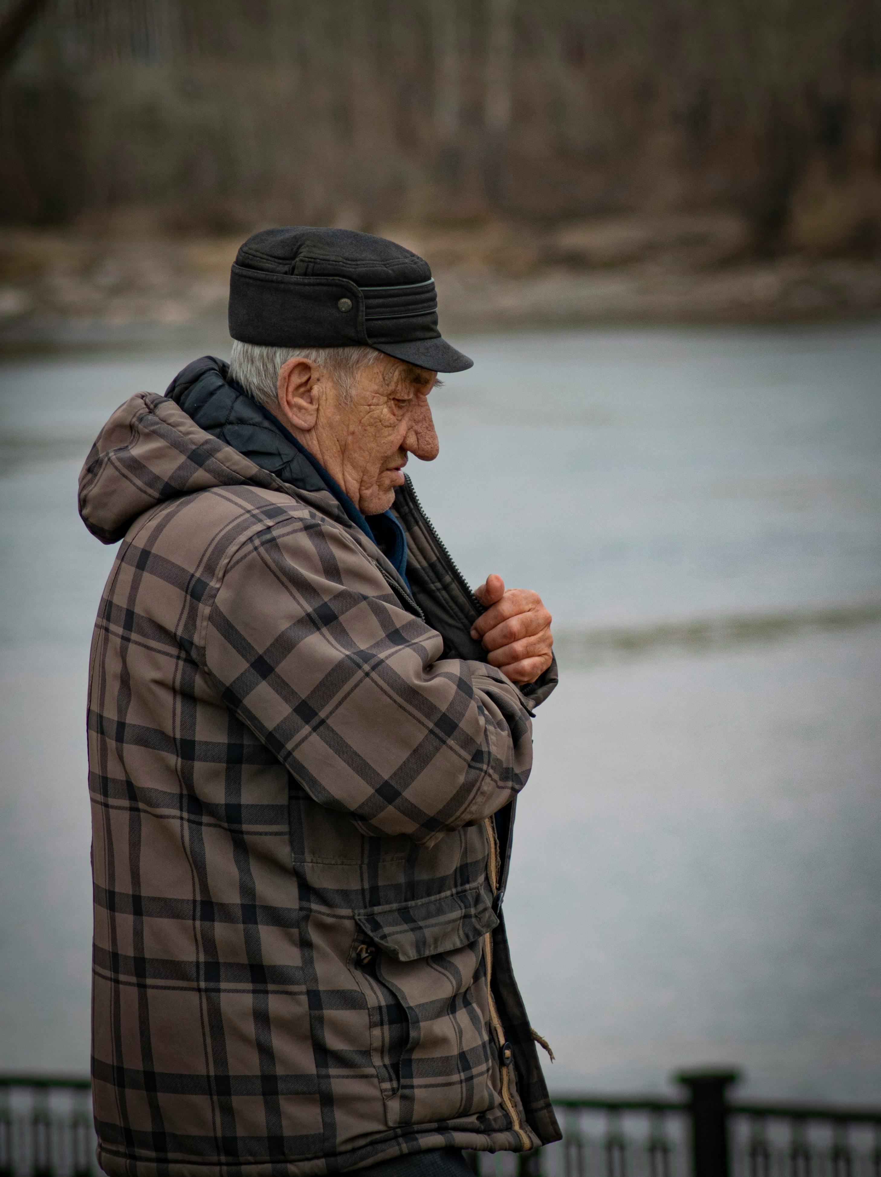 An Elderly Man in Black Leather Jacket Smoking · Free Stock Photo