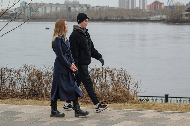 Couple Walking Along River