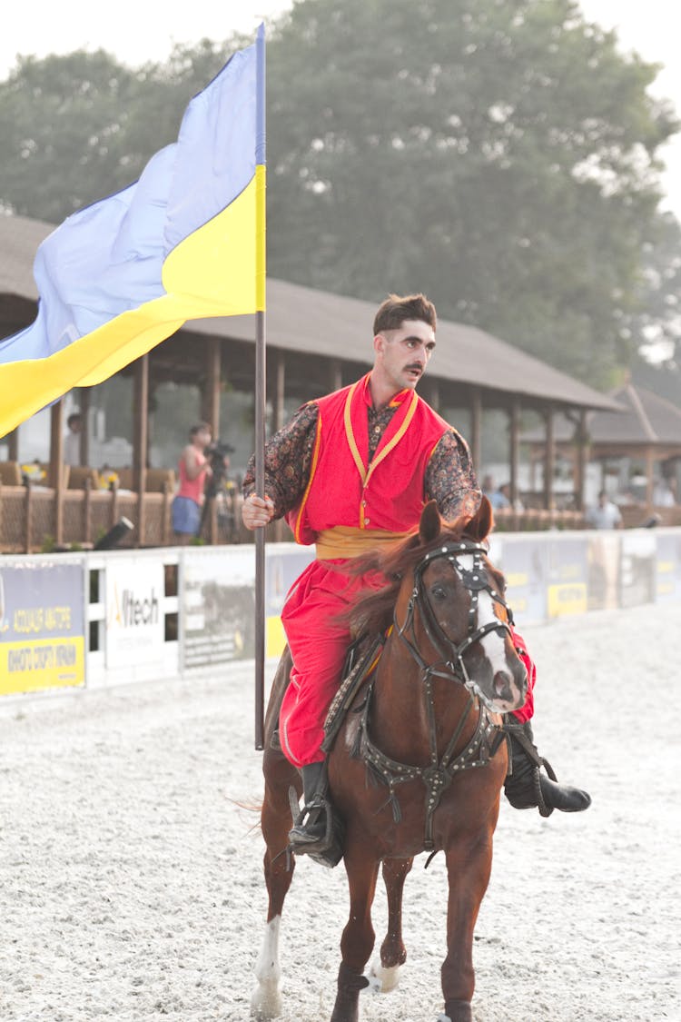 Man On Horse Holding Ukrainian Flag