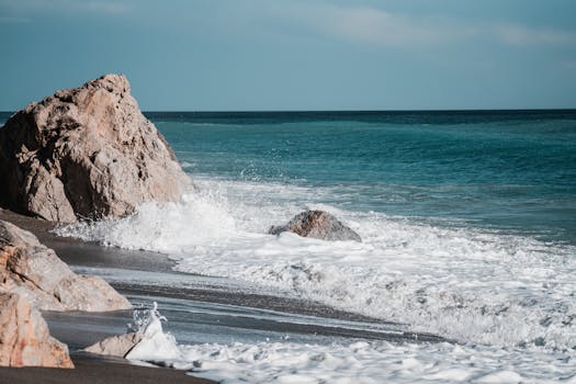 Capture the power of waves crashing on rocks at Finale Ligure, Liguria, Italy.
