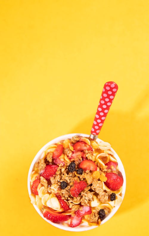 Fruits with Cereal on Yellow Background
