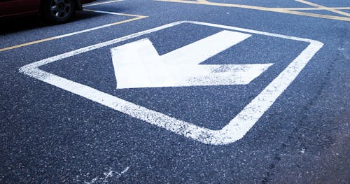 White Road Arrow Sign