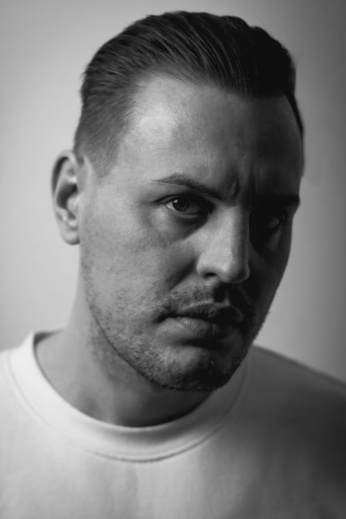 Free Intense black and white portrait of a man with a thoughtful expression. Stock Photo