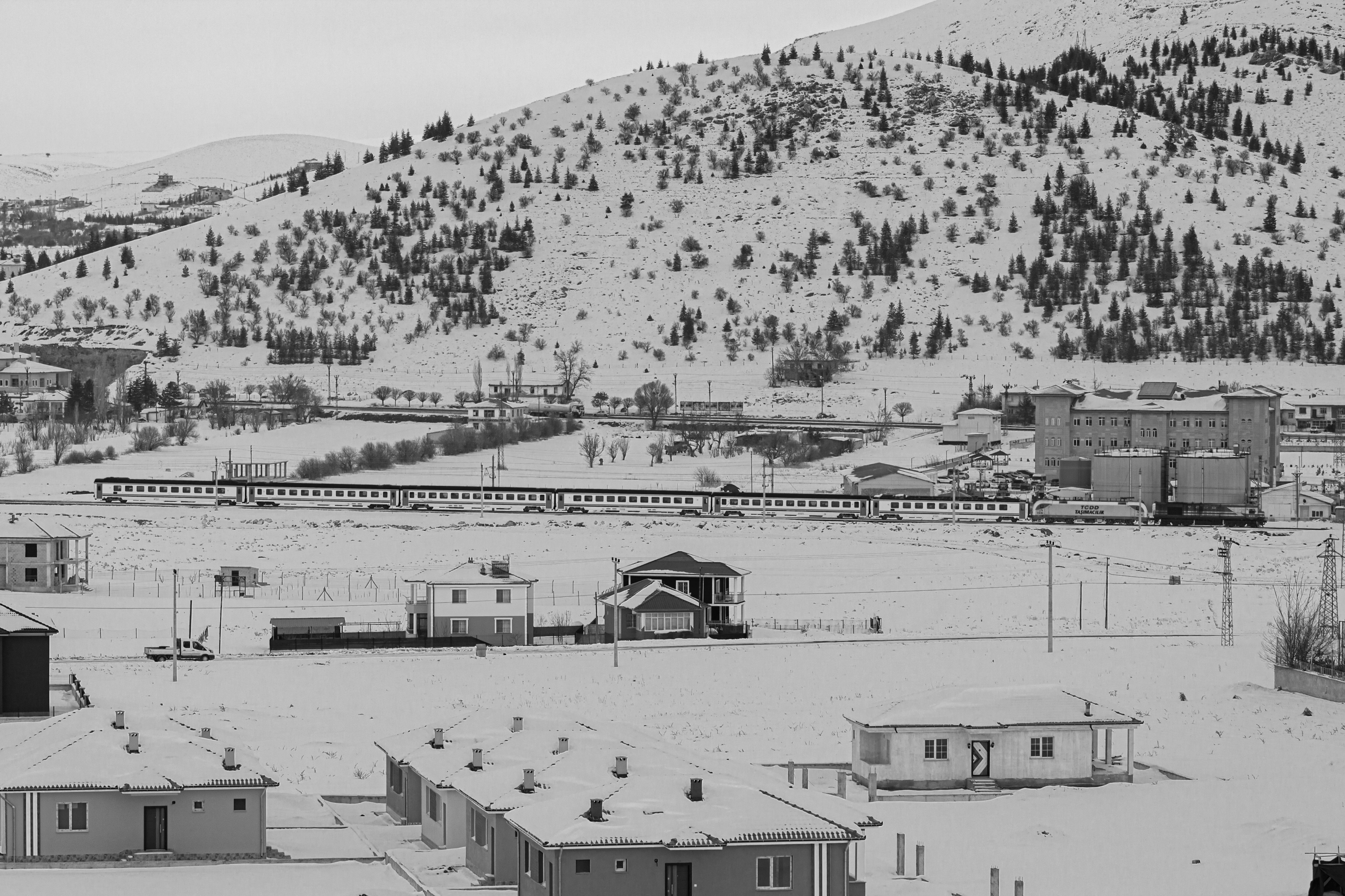 The Doğu Ekspresi train traveling through a snowy landscape in Eastern Turkey