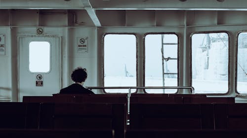 Back View of a Man Sitting in a Ferry 