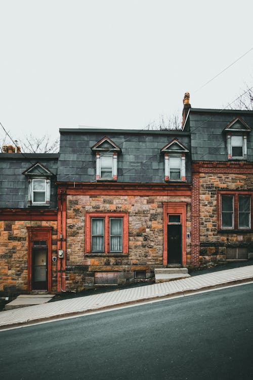 A Houses with Brick Walls on the Street