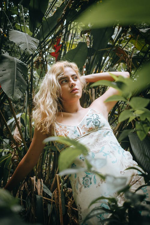 Woman in White Floral Dress Posing in the Jungle