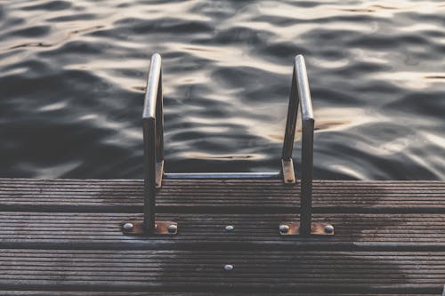 Gray Steel Dock Ladder Beside Body of Water