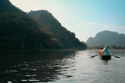 People Riding on Boat on a Lake