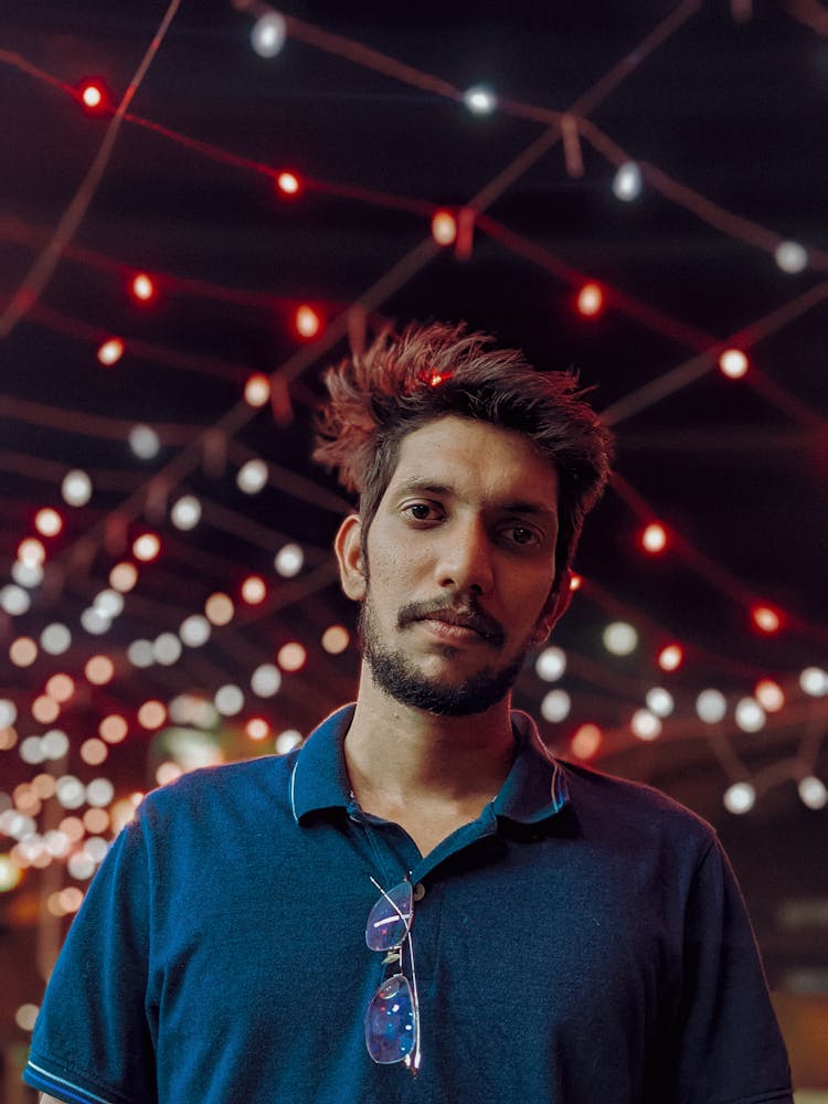 Bearded Young Man In Blue Polo Shirt