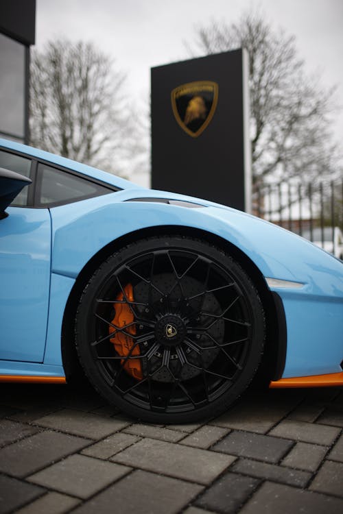 Blue Car Parked Near a Signage