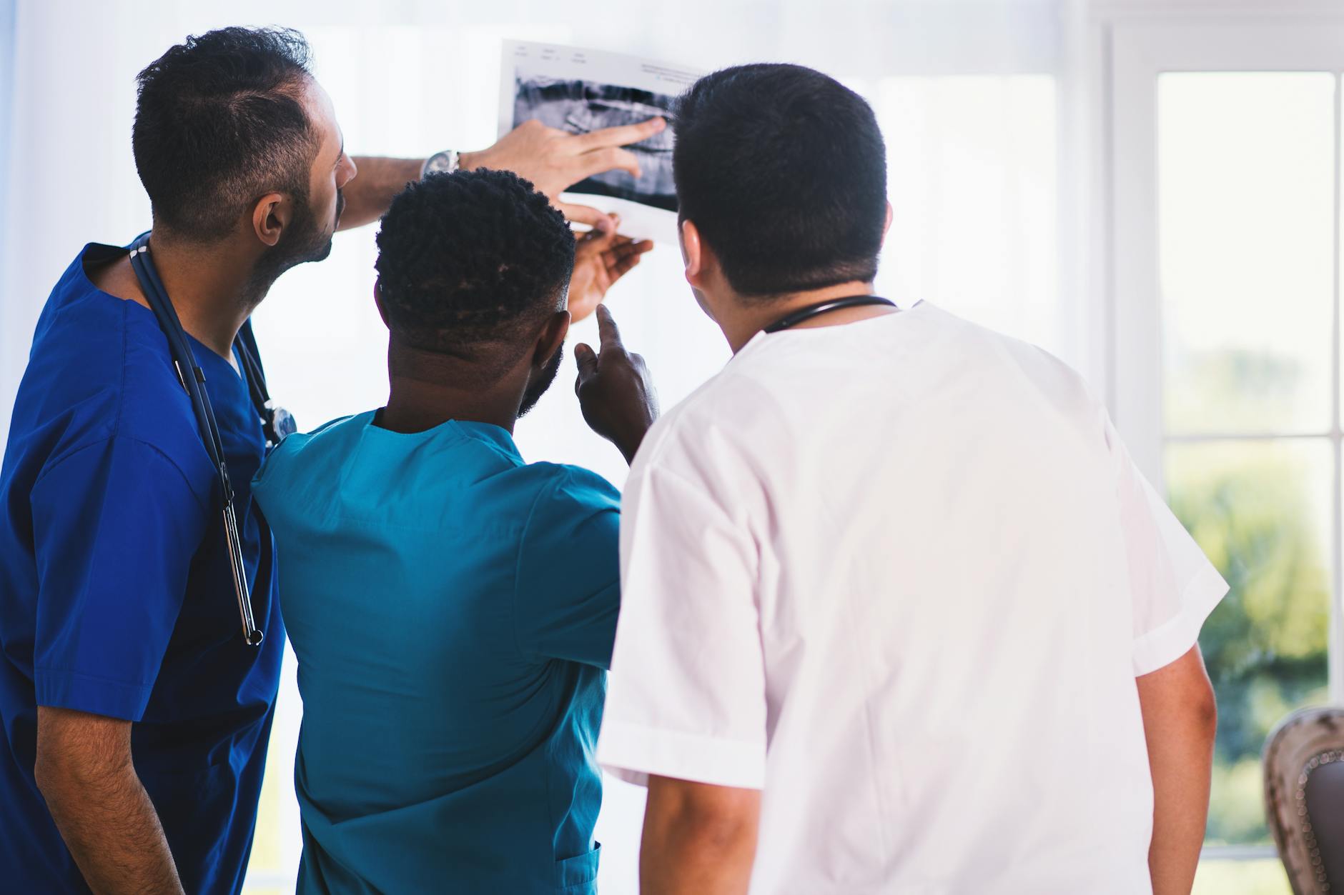 three man looking at the paper respiratory therapist salary