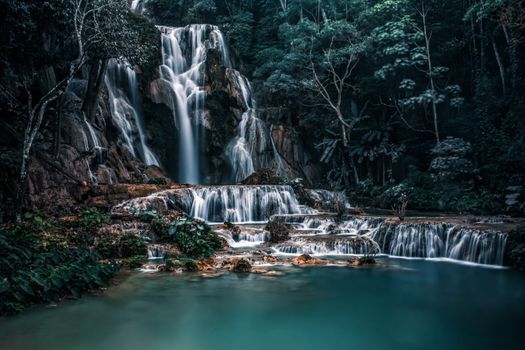 Stunning view of Kuang Si Waterfall in Laos captured in lush green surroundings.