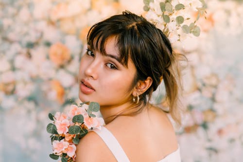 Selective Focus of a Woman with Flowers