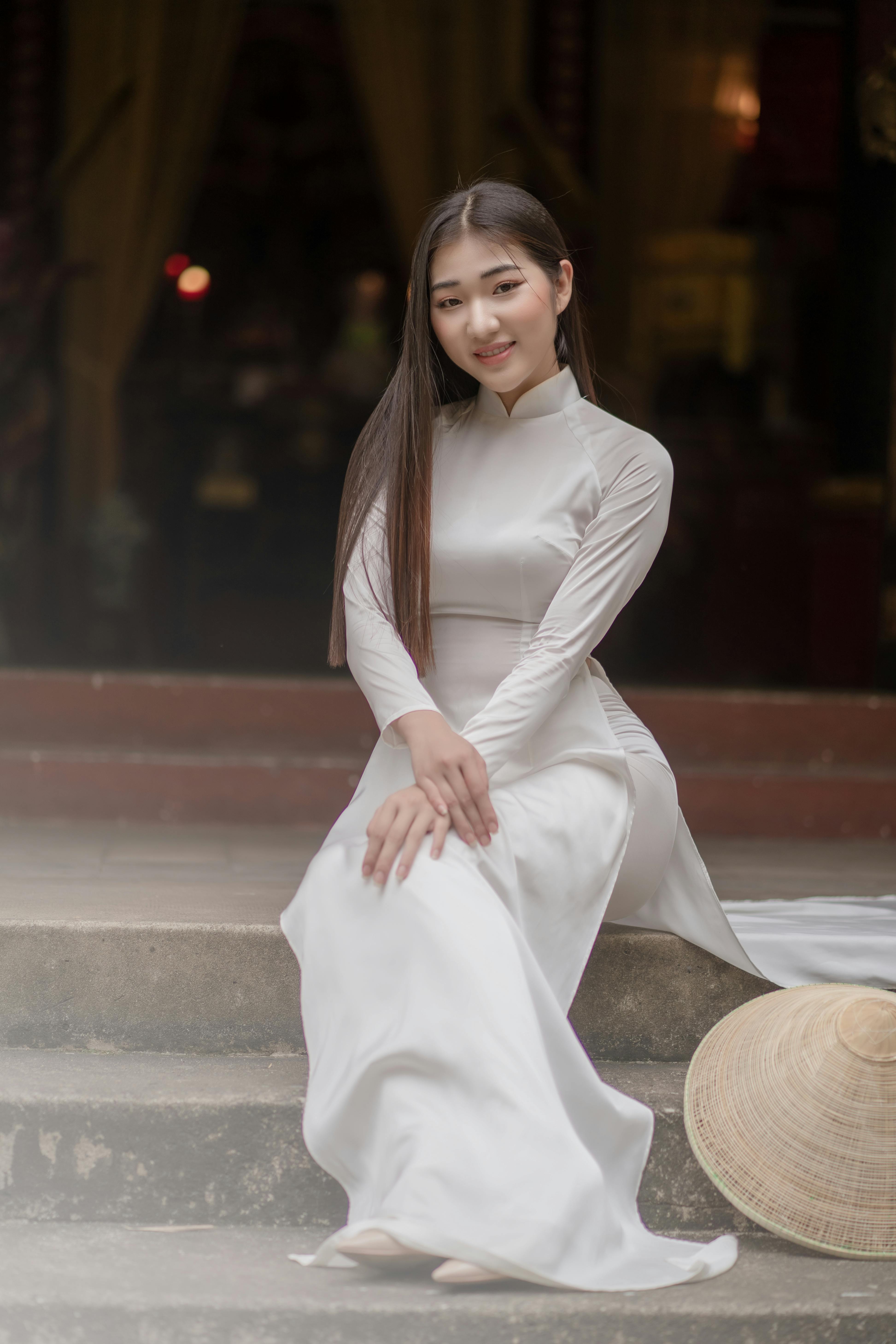 pretty woman wearing a white ao dai