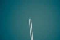 An Airplane Under Blue Sky