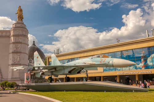 Free Sukhoi fighter jet exhibit at a museum in a vibrant town square, Russia. Stock Photo