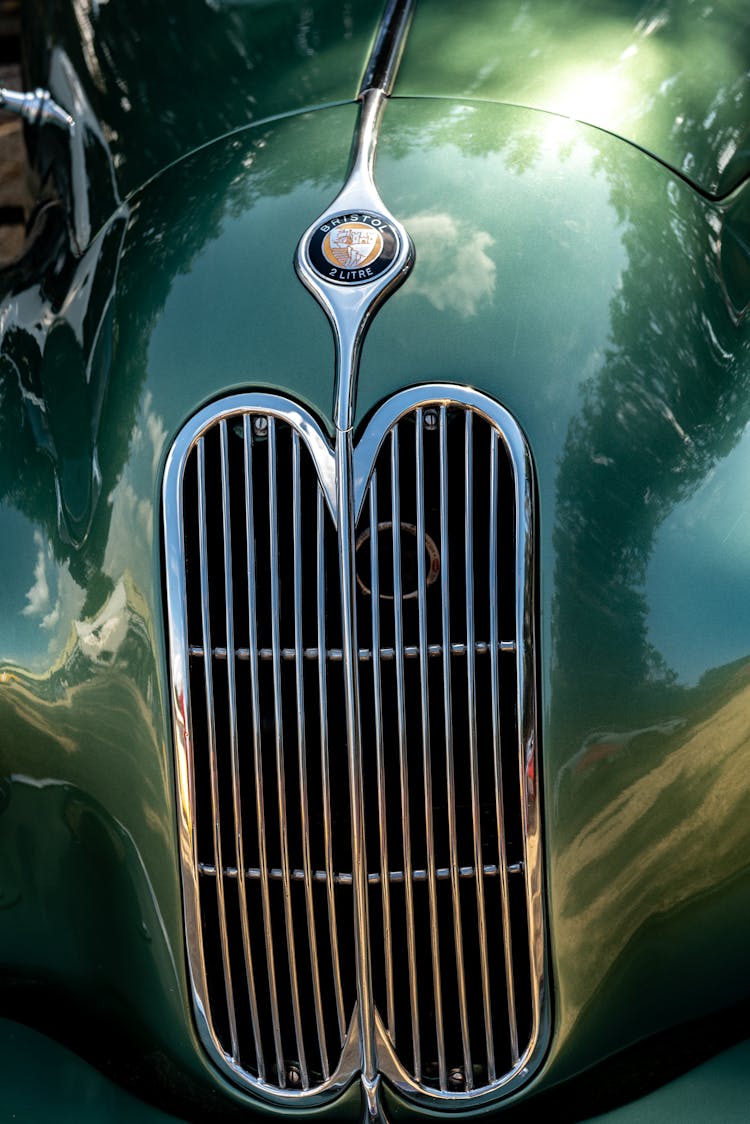 Green Vintage Car With Bristol Logo