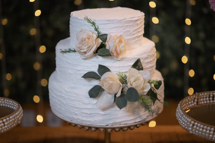 A Minimalist Wedding Cake On A Stand