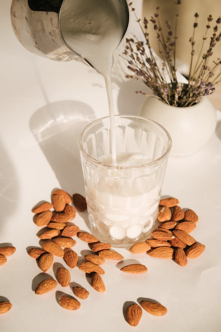 Pouring Milk On A Glass