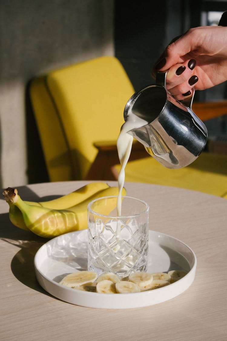 Pouring Milk Into A Glass