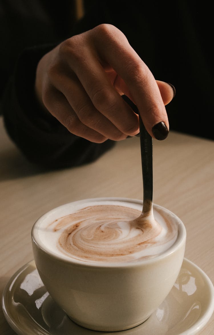 Woman Stirring Coffee