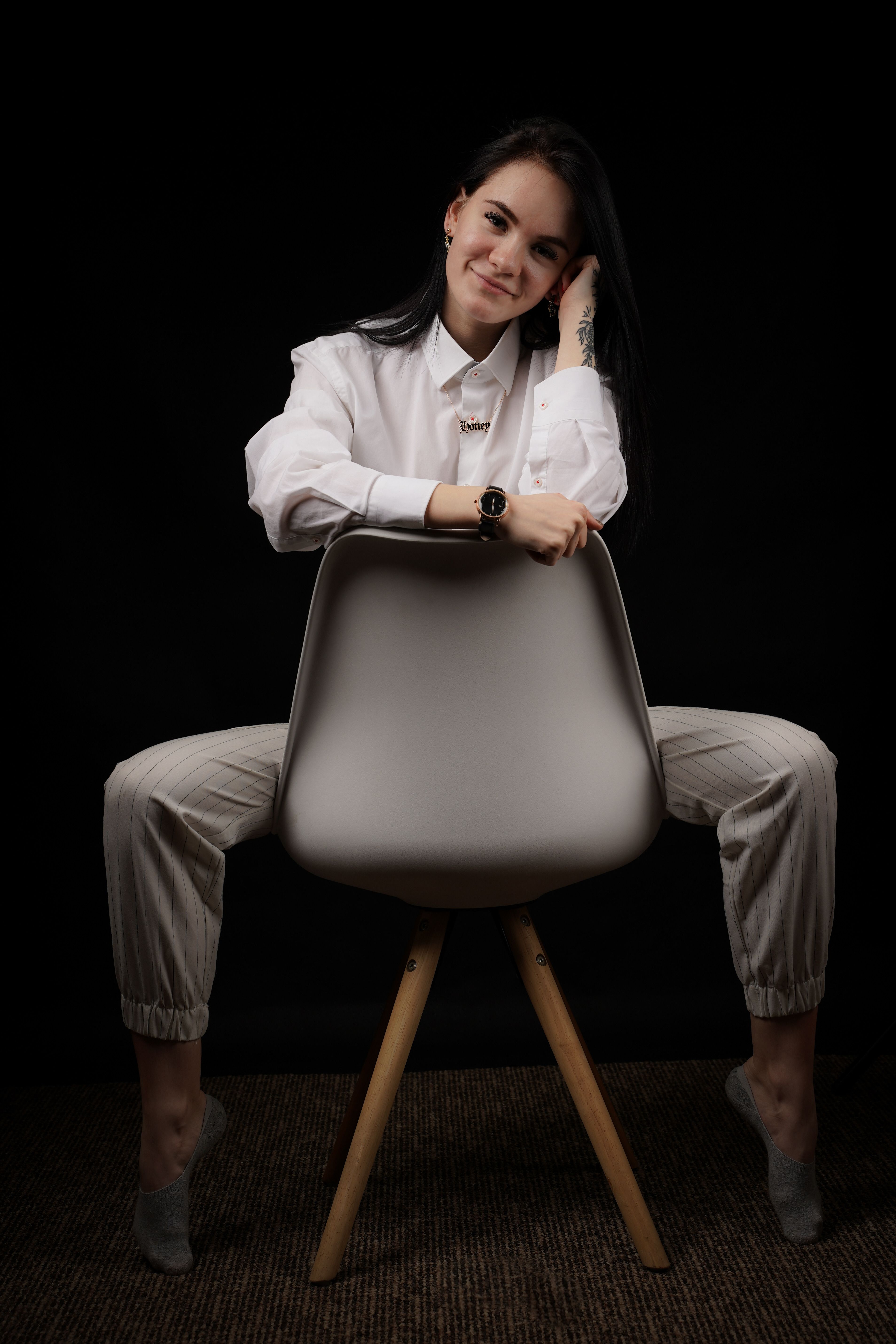 Woman in White Long Sleeves Sitting on a Chair · Free Stock Photo